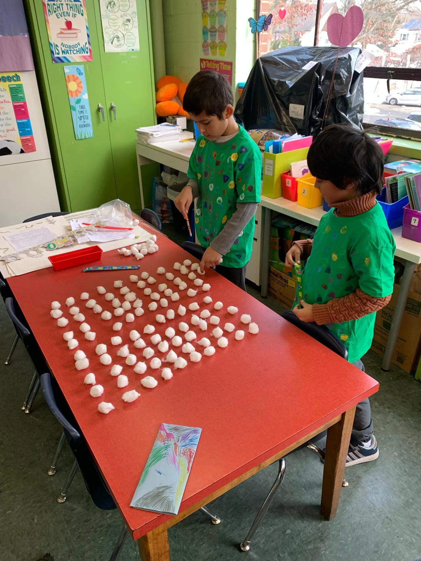 Elementary students arranging hands-on mathematics materials