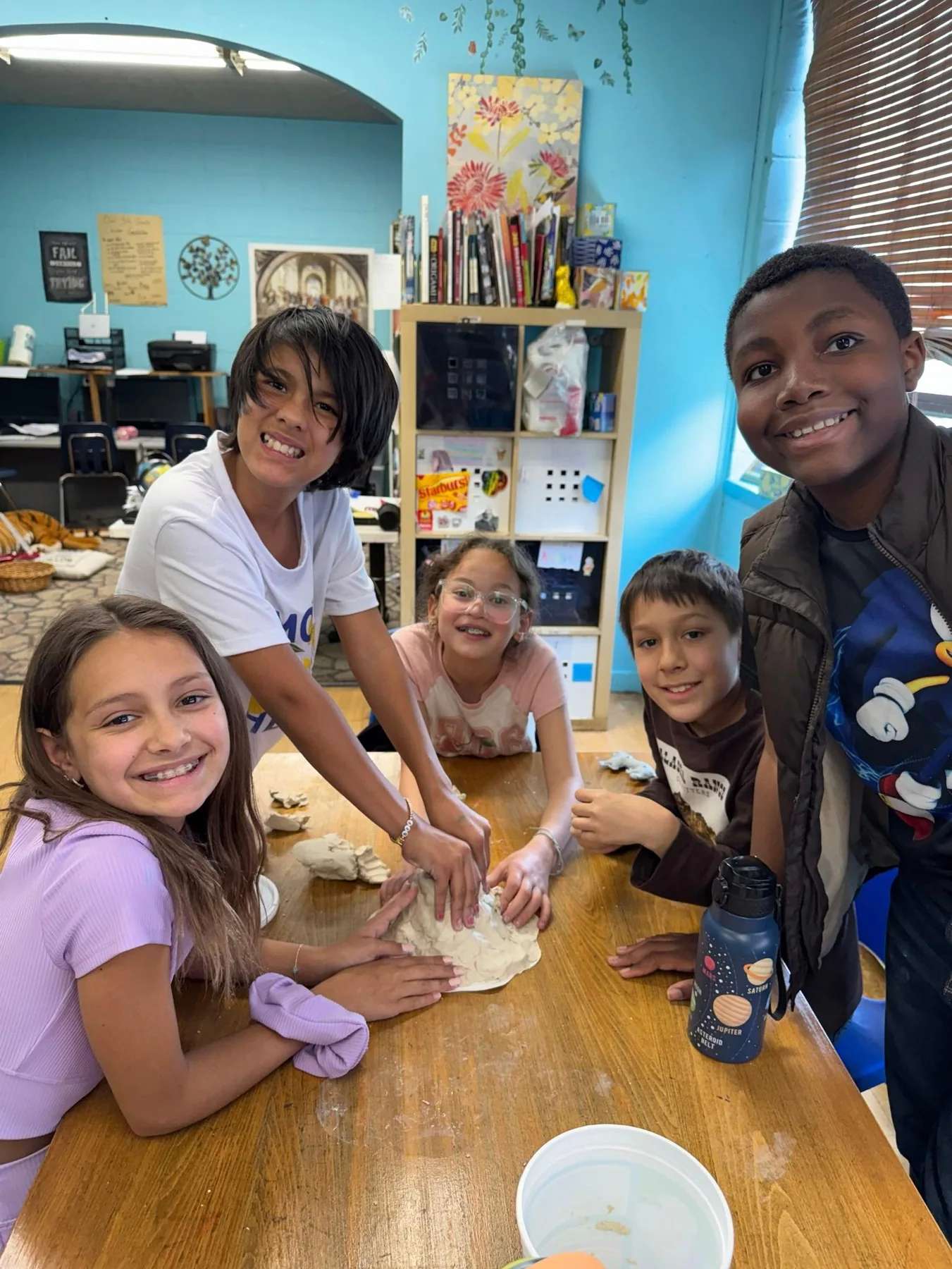 Progressive students sharing hands-on classroom work together